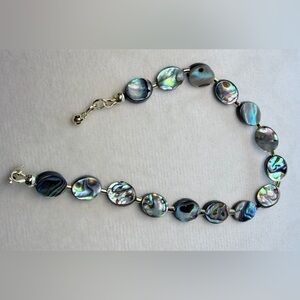 Abalone shell bracelet,colorful iridescent, oval,small gold spacers. 7.5”-7.75”.
